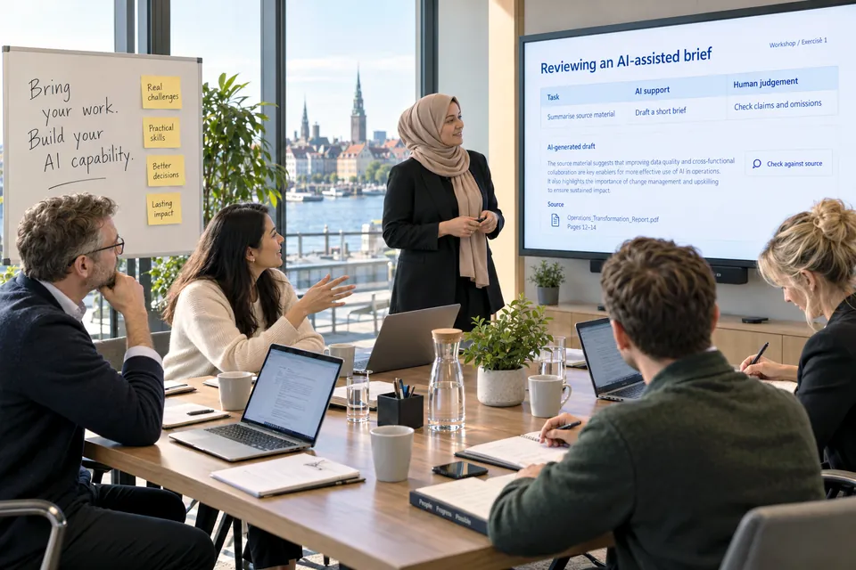 Participants discuss an AI-assisted brief with a facilitator in a bright waterfront workshop room.
